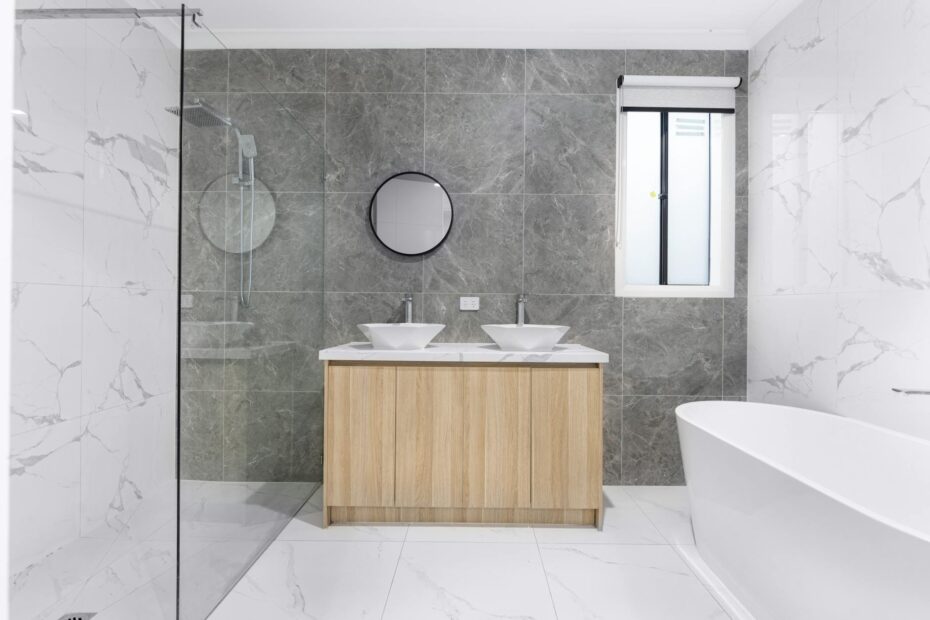 A sleek and stylish modern bathroom with minimalist design, featuring dual washbasins, marble til... (Photo by Arshad Khan on Pexels)