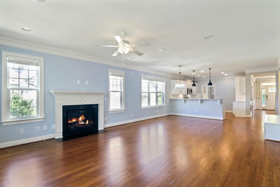Spacious living room featuring a modern fireplace and wooden flooring, ideal for home decor inspi... (Photo by Curtis Adams on Pexels)